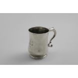 AN EARLY GEORGE III SMALL SCOTTISH MUG of baluster form with a scroll handle, inscribed on the front