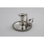 ROYAL ASSOCIATION:- An early Victorian circular chamberstick with gadrooned borders, a detachable