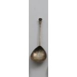 A CHARLES I ASCRIBED WEST COUNTRY SEAL TOP SPOON with a gilt terminal, and pricked initials &