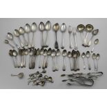 A MIXED LOT OF FLATWARE:- A pair of Victorian Fiddle sauce ladles, six various table spoons, four