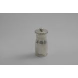 A LATE 20TH CENTURY PEPPER GRINDER of baluster form, with metal innards, by the Guild of