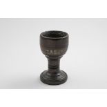 AN INTERESTING TURNED OAK TOASTMASTER'S GOBLET with the let-in pieces of cut silver strips*,