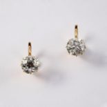 A PAIR OF DIAMOND EARRINGS set with two old cushion shaped diamonds weighing approximately 2.25