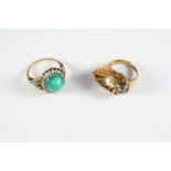 A TURQUOISE AND DIAMOND CLUSTER RING the oval-shaped turquoise cabochon is set within a surround