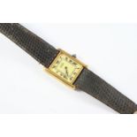 A LADY'S SILVER GILT WRISTWATCH BY MUST DE CARTIER the signed rectangular-shaped dial with Roman