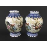 TWO CHINESE FAMILLE ROSE VASES of ovoid form painted with cockerals, ducks and flowering foliage,