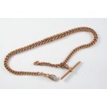 A 9CT ROSE GOLD CURB LINK WATCH CHAIN each link marked 9 375, and suspending a 9ct gold 't' bar,