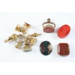 FIVE ASSORTED GOLD FOB SEALS each mounted with a hardstone matrix, a gold watch key and a gold