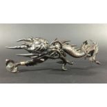 JAPANESE BRONZE DRAGON later 19th century, cast in a dramatic pose holding a glass or rock crystal