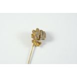 OF GOLD PROSPECTING INTEREST: a stick pin mounted with gold in quartz matrix