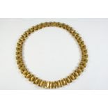 A 15CT GOLD COLLAR NECKLACE formed with geometric design links, with concealed clasp, 42cm long,