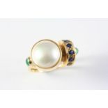 A MABE PEARL, EMERALD AND SAPPHIRE RING the mabe pearl is set with two emerald cabochons and six