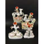 PAIR OF STAFFORDSHIRE ZEBRA AND FOX SPILL VASES the animals leaping over a stream and bridge, height