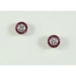 A PAIR OF RUBY AND DIAMOND CLUSTER STUD EARRINGS each earring set with a circular-cut diamond within