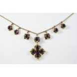 A GEORGIAN AMETHYST, ENAMEL AND PEARL NECKLACE the quatrafoil pendant is mounted with four