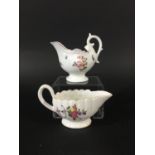 DERBY FLUTED BUTTER BOAT circa 1765, painted with flowers, length 12cm; and a Derby Dolphin Ewer,