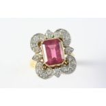 A PINK TOURMALINE AND DIAMOND CLUSTER RING the cut-cornered rectangular-shaped pink tourmaline is