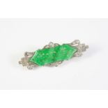 AN ART DECO AND DIAMOND PLAQUE BROOCH the pierced and carved jade is set within a surround
