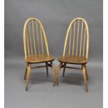 ERCOL DINING CHAIRS a set of 4 light coloured stick back chairs. (4)