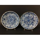 PAIR OF CHINESE BLUE AND WHITE KRAAK STYLE PLATES painted with flowers inside an arched border and