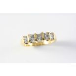 A DIAMOND HALF HOOP RING set with five circular-cut diamonds, in 18ct gold. Size R