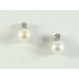 A PAIR OF DIAMOND AND CULTURED PEARL STUD EARRINGS each set with a cultured pearl measuring