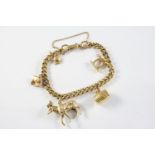A 9CT GOLD CURB LINK BRACELET suspending five assorted charms, total weight 31.3 grams