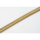 A GOLD FANCY LINK BRACELET with concealed clasp, 21cm long, 47.9 grams