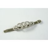 AN ART DECO DIAMOND BRACELET the three conjoining circles millegrain set with circular-cut diamonds,