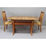 DANISH TEAK DINING TABLE & CHAIRS a teak extending dining table with 2 additional leaves, the top