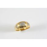 A DIAMOND AND GOLD RING the gold band is mounted with circular-cut diamonds. Size R