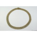 A 9CT GOLD FANCY LINK COLLAR NECKLACE with concealed clasp, 42cm long, 34.8 grams