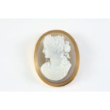 A FRENCH CARVED HARDSTONE CAMEO BROOCH PENDANT depicting the head and shoulders of a classical