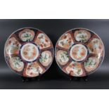 PAIR OF JAPANESE IMARI CHARGERS 19th century, a kakiemon style centre inside six panels with lions