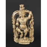 INDIAN CARVED IVORY FIGURE GROUP probably Nayak, early 17th century, of Krishna holding a butter