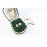 A PAIR OF MOTHER OF PEARL AND RUBY DRESS BUTTONS each mother of pearl disc is centred with a
