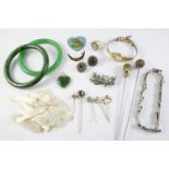 A QUANTITY OF JEWELLERY including two jade bangles, a gold crescent brooch, a jade pendant,