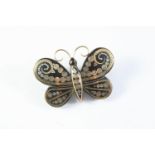 A VICTORIAN PIQUE BUTTERFLY BROOCH with gold and silver decoration, 4cm wide