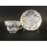 CHAMPION BRISTOL PORCELAIN BREAKFAST CUP AND SAUCER circa 1770, of fluted, ogee form painted with