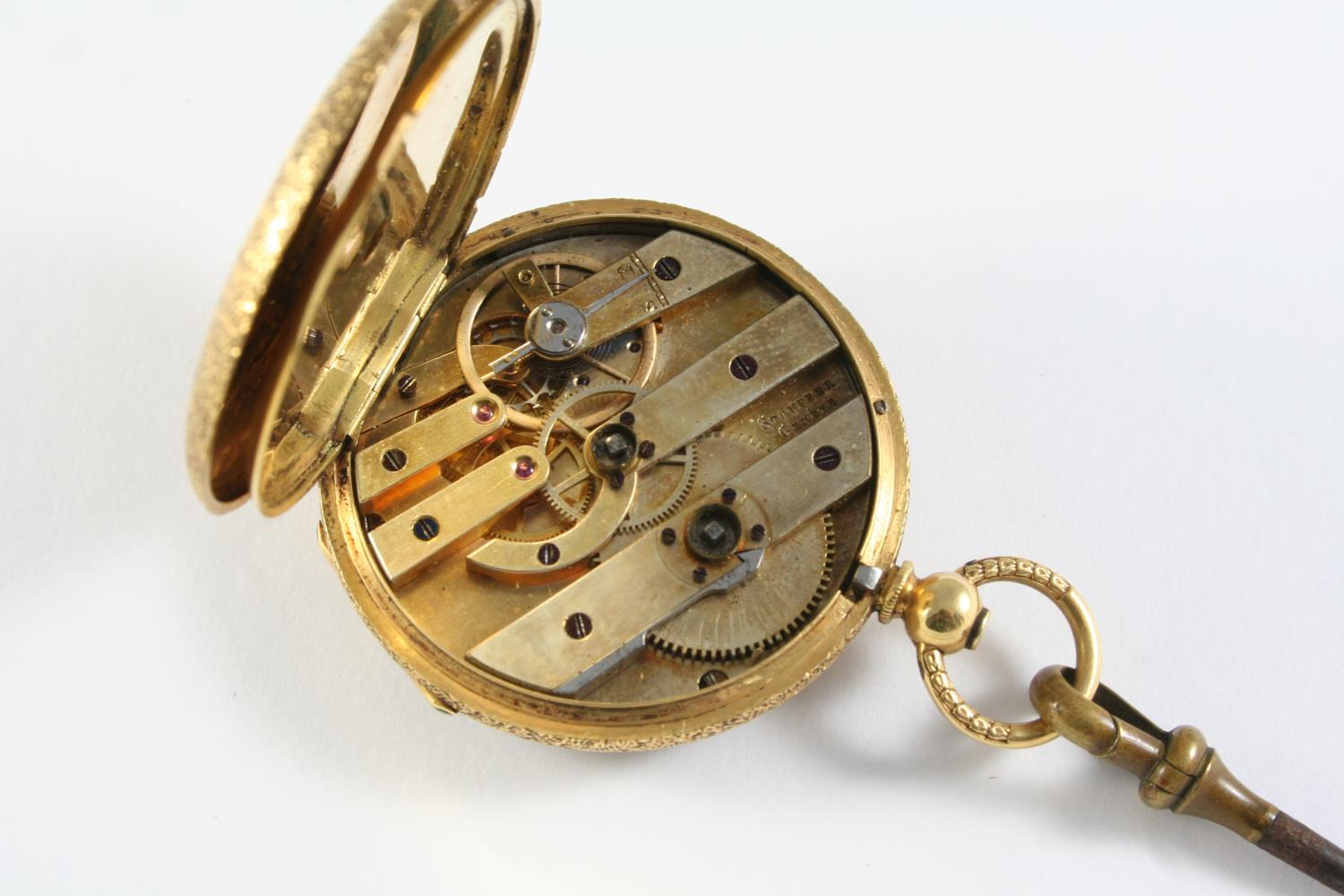 AN 18CT GOLD OPEN FACED POCKET WATCH the gold coloured dial with Roman numerals and foliate engraved - Image 2 of 2