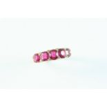 AN ANTIQUE RUBY AND DIAMOND HALF HOOP RING the five graduated oval-shaped rubies are set with rose-