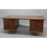 GORDON RUSSELL ROSEWOOD & MAHOGANY DESK circa 1962, the large desk with a solid mahogany frame and