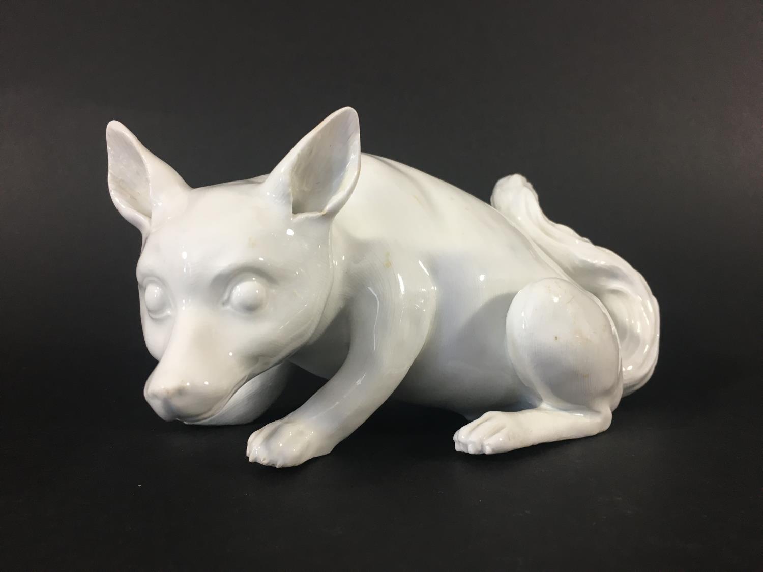 MEISSEN FOX probably later 18th century, crouching, in white, blue crossed sword marks to edge,