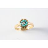 A TURQUOISE AND DIAMOND CLUSTER RING the central diamond is set within a surround of turquoise