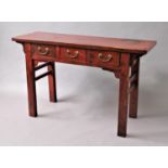 CHINESE RED LACQUERED ALTER TABLE with three drawers on rectangular section legs, height 83cm, width