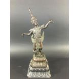 SOUTH EAST ASIAN FIGURE perhaps Java or Thai, standing with arms outstretched, on a lotus base and