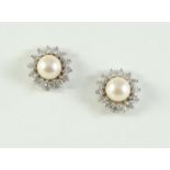 A PAIR OF CULTURED PEARL AND DIAMOND STUD EARRINGS each set with a cultured pearl measuring