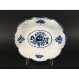 BOW MOULDED DISH circa 1755-60, blue painted with flowers and butterflies on a moulded ground,