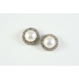 A PAIR OF MABE PEARL AND DIAMOND STUD EARRINGS each set with a mabe pearl within a surround of