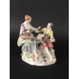 MEISSEN GROUP 19th century, modelled as a rustic couple with a sheep, she with as basket of